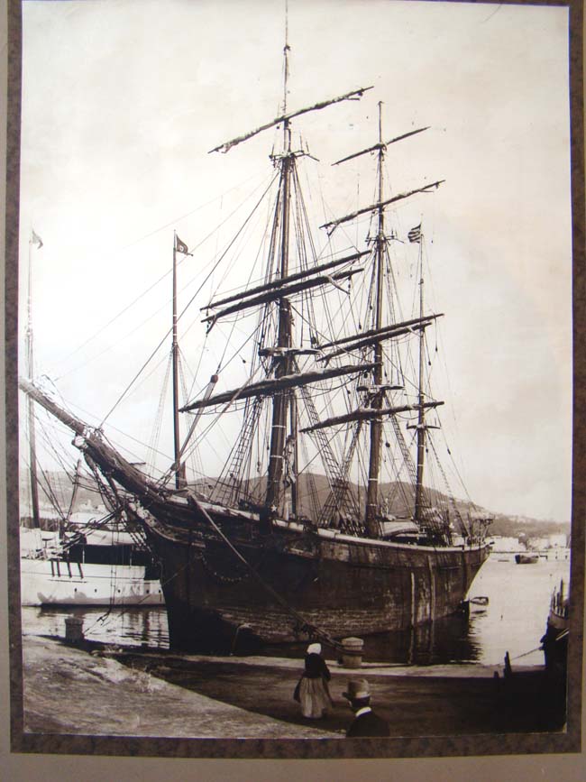 An original 19th century sepia photograph of an American ship tied up at a wharf circa 1860-1880